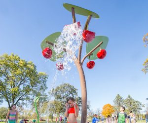 fruit themed water dumper splash pad